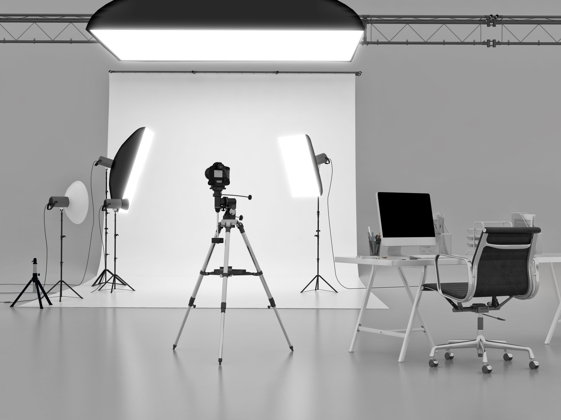 Empty modern photo production studio interior with professional lighting setup and photography equipment,